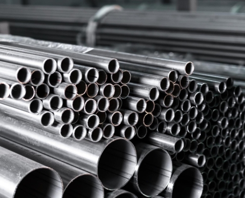 Bundles of steel pipes in a warehouse